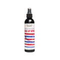 A black spray bottle of Salon Candler Edge Up Spray with a white, red, and blue striped label, shown on a plain white background.