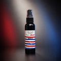 A 2 fl oz black spray bottle of Happy Beard Beard Oil by  Salon Candies, standing on a dark surface against a dramatic red and blue gradient background.