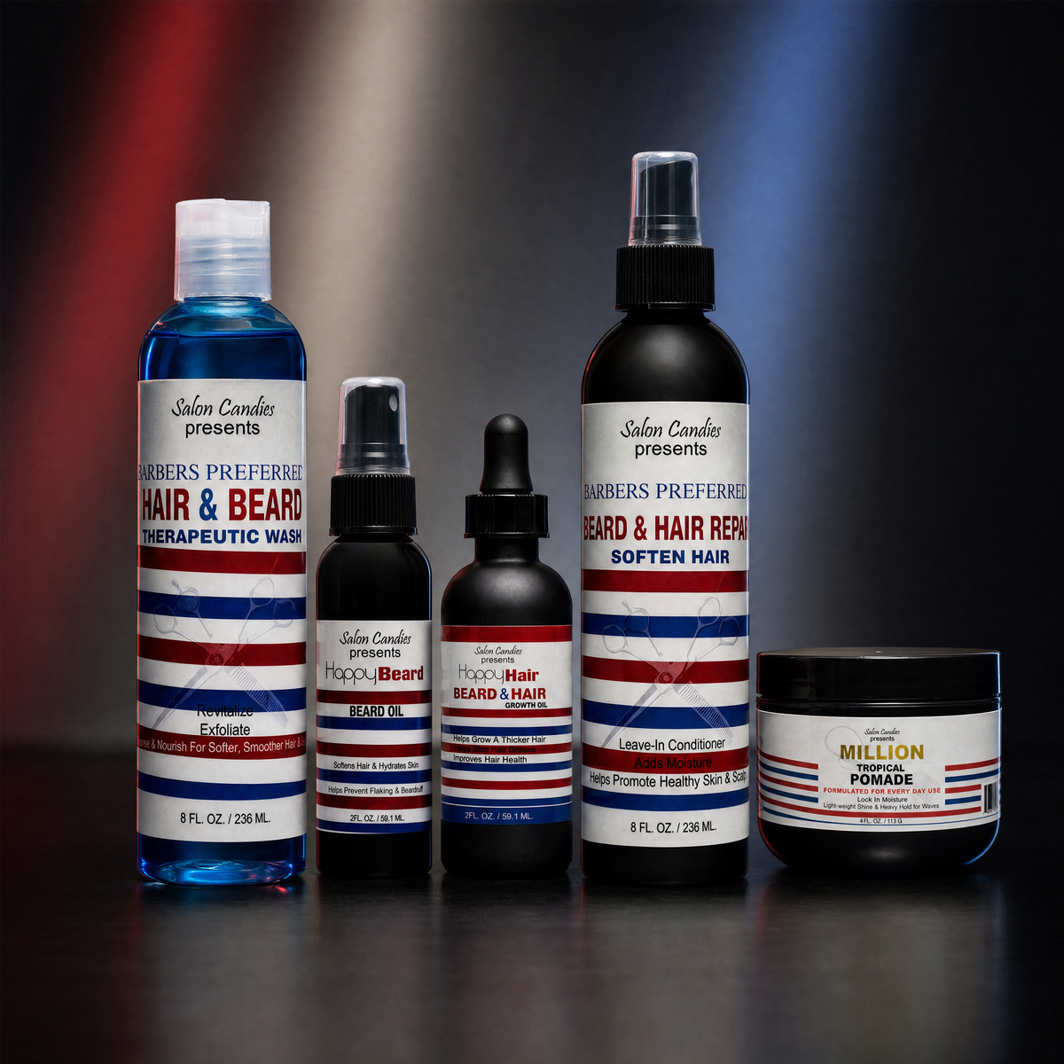 A lineup of five Salon Candies hair and beard care products on a dark reflective surface with a red, white, and blue gradient background. The products include a blue liquid wash, a black spray, a black dropper bottle, a black pump bottle, and a black jar of wax pomade.