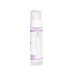 A clear plastic pump bottle with a white pump dispenser and a white label featuring purple accents, shown against a plain white background.