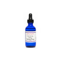 A cobalt blue glass dropper bottle of Salon Candles Hair & Scalp Therapy Healing Drops on a plain white background.