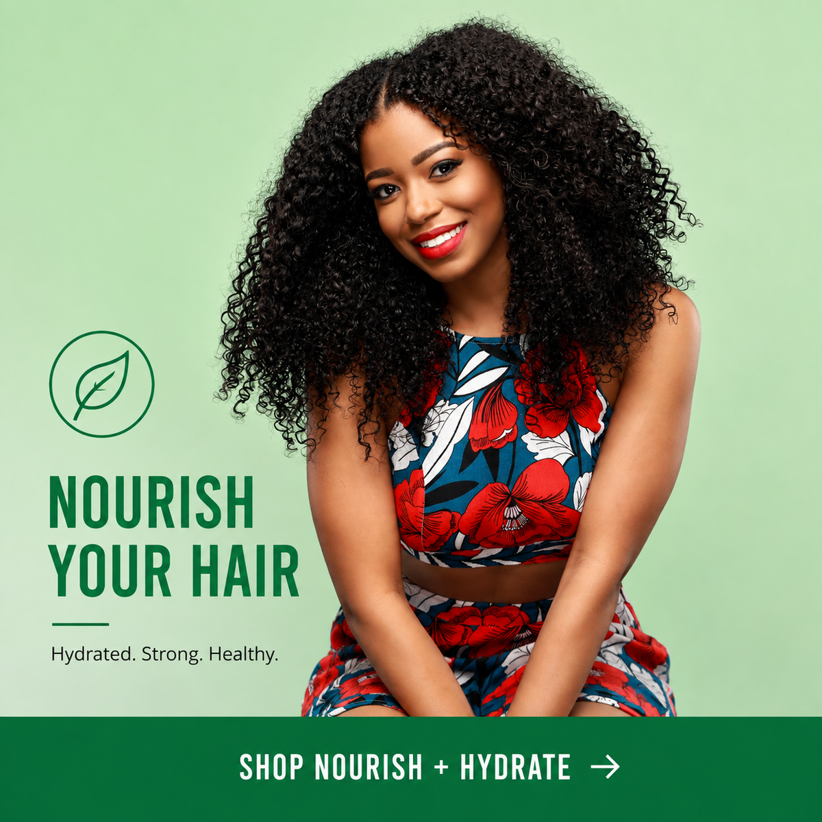 A smiling woman with voluminous curly black hair is seated against a light green background, wearing a floral sleeveless top and matching bottoms. Large text on the left reads 'NOURISH YOUR HAIR' with a leaf icon, and a green banner at the bottom says 'SHOP NOURISH + HYDRATE'.