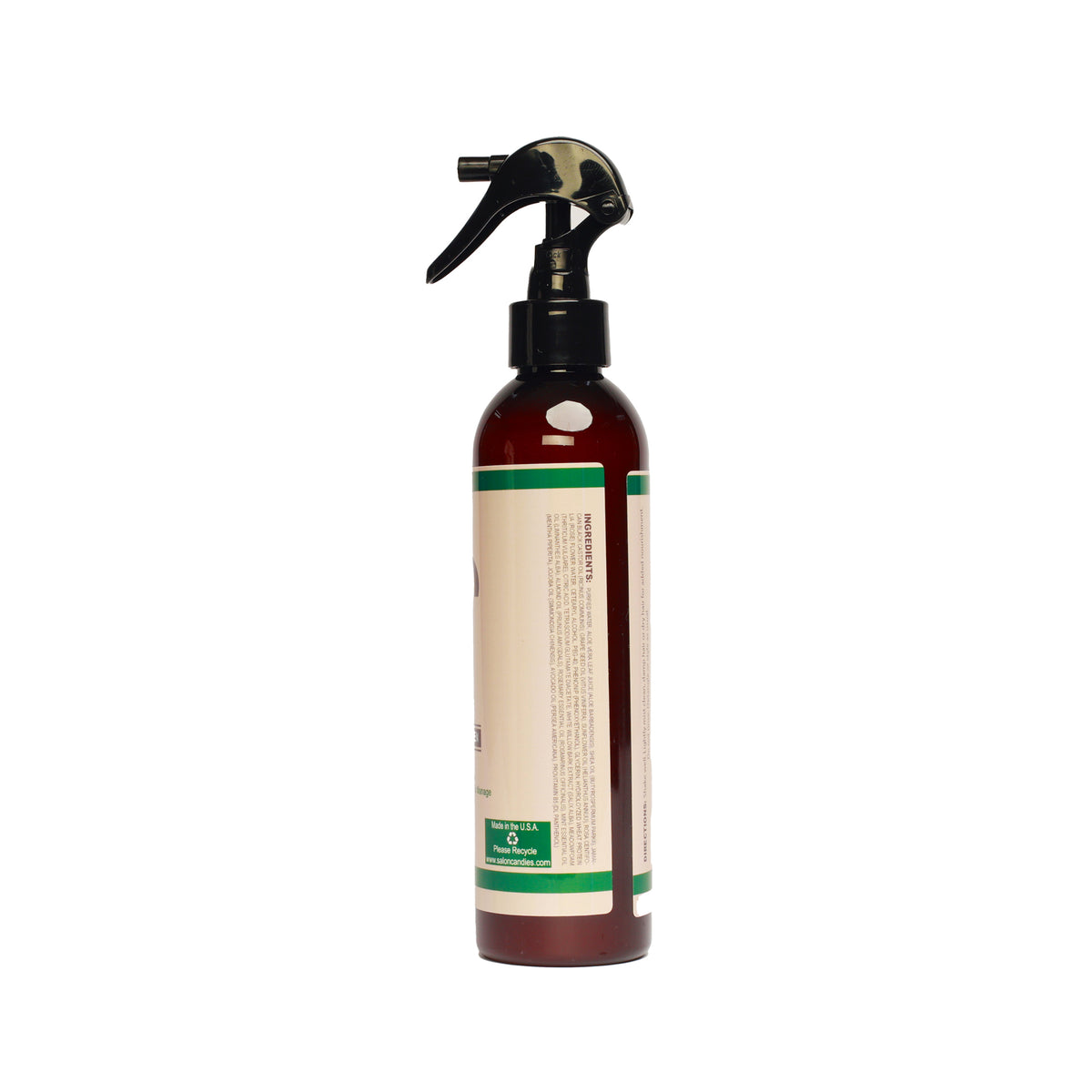 An amber glass spray bottle with a black trigger sprayer and a cream-colored label featuring green accents, shown against a plain white background.
