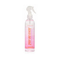 A clear plastic spray bottle with a white trigger sprayer, containing a pink liquid. The label features vertical text reading 'SPRAY AND REMOVE' in orange, with 'Shag Color' written at the top, set against a plain white background.